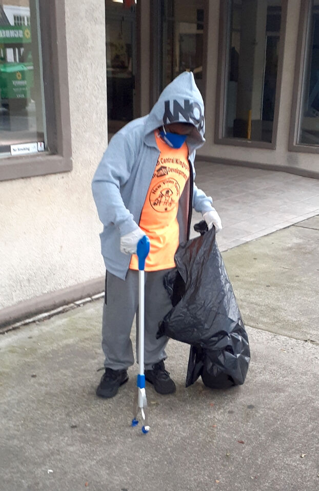 New Vision Youth members volunteer at downtown cleanup